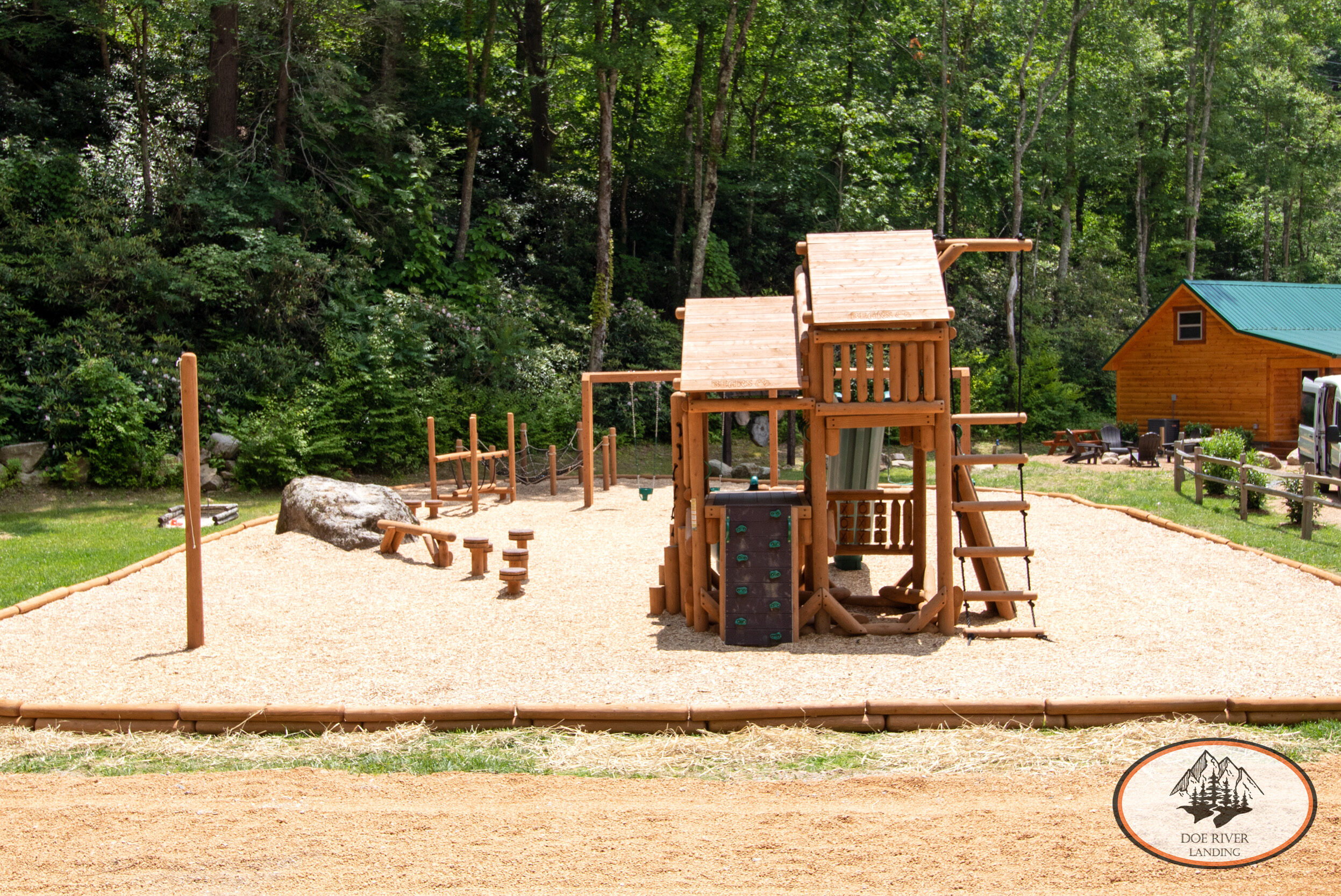 Doe River Landing campground in Roan Mountain, TN. Best vacation rental near Elizabethton, TN and Johnson City TN. Enjoy the playground, the obstacle course, target practice, tether ball, Toy Barn, community fire pit, river access, and more.